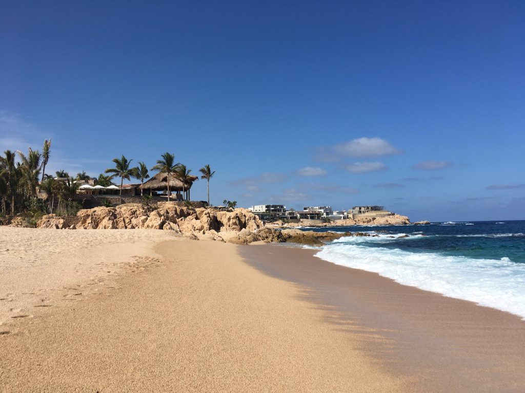 Soft sand and white-capped waves of blue water at Playa el Chileno near Cabo San Lucas, Mexico photo © KateDana