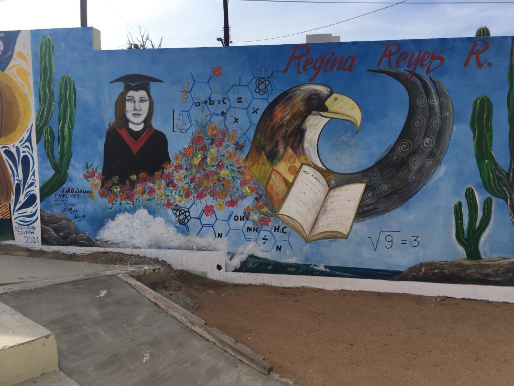 Colorful artwork depicting graduating students on a wall at Cerro del Timbre, Cabo San Lucas, Mexico photo © Kate Dana