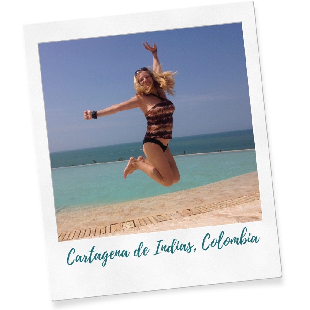 Kate Dana, founder of COCAMECA jumps for joy near a swimming pool in Los Morros, Cartagena, Colombia, photo ©2023 Kate Dana | COCAMECA all rights reserved