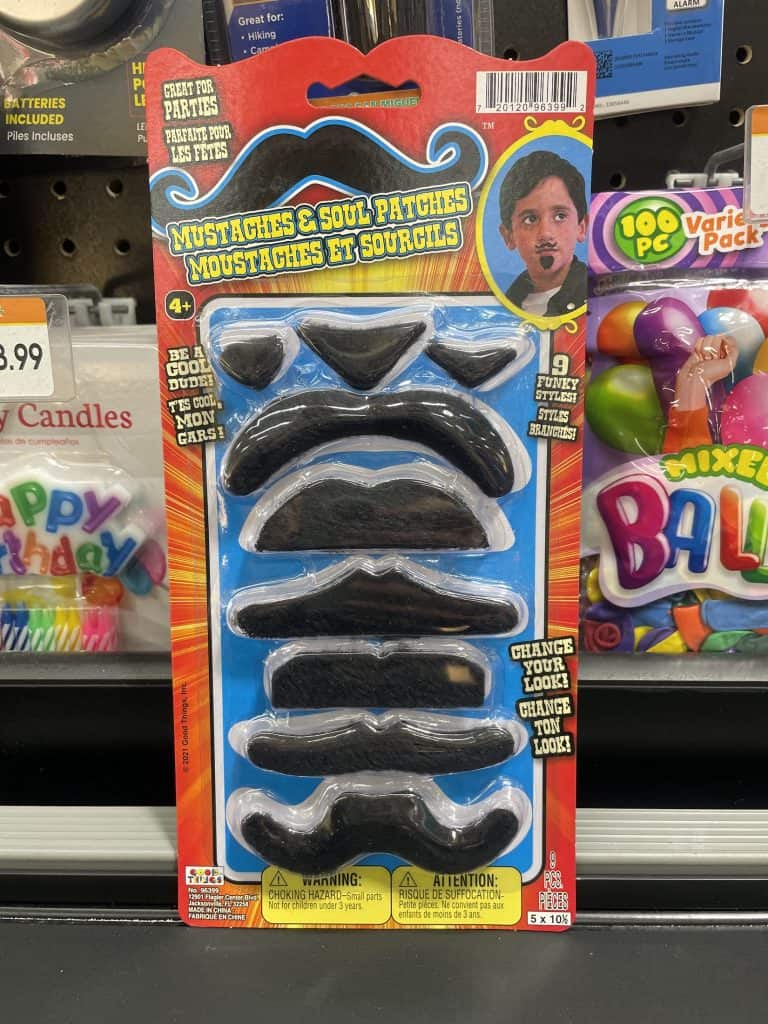 A plastic-sealed cardboard package features a kid with several styles of fake mustaches in furry fabric: one of the many treasures found while thrift shopping in San Luis Obispo, near the Santa Maria Valley, California, photo © Kate Dana