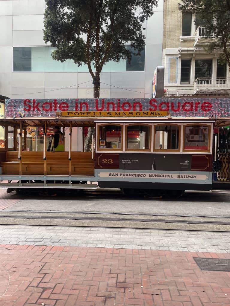 An historic cable car for the San Francisco Municipal Railway announces "Skate in Union Square" in this photo for 45 California Sayings to Get Stoked About Right Now, photo © Kate Dana