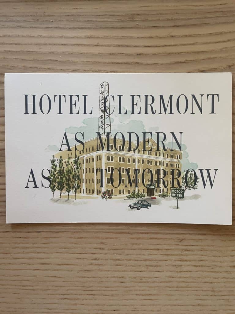 A matte-colored illustrated post card in neutral colors announces, "Hotel Clermont As Modern As Tomorrow" with an image of the vintage hotel in Atlanta, GA photo ©Kate Dana