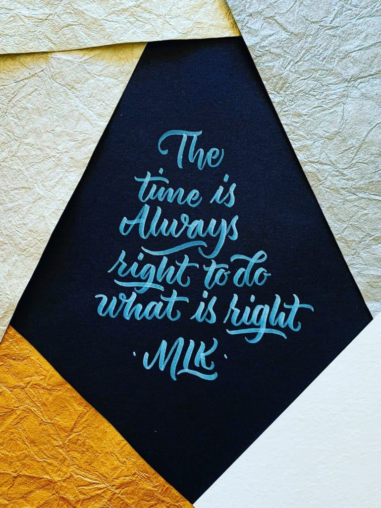 A cut graphic and handlettered sign reminds us all "The time is Always right to do what is right" by Rev. Dr. Martin Luther King, Jr, photo ©Darold Pinnock for unsplash