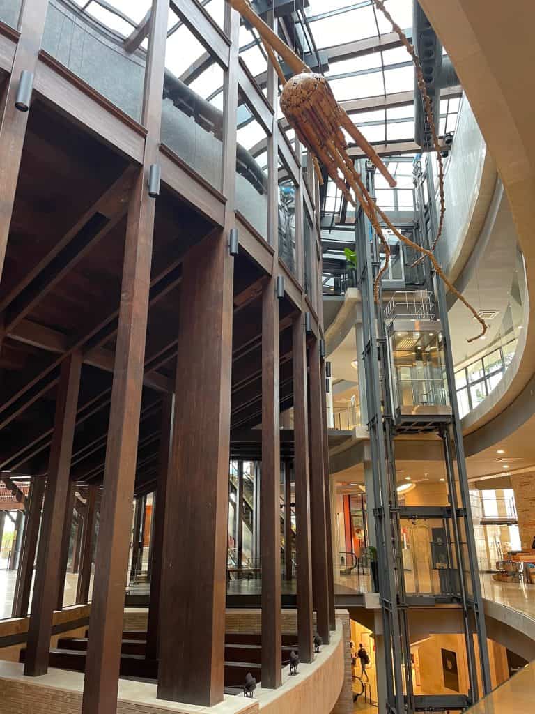 The ancient dark wood and clear glass of an elevator gleam beautifully inside Centro Comercial La Serrezuela, formerly a bullfighting ring, in Cartagena, Colombia, a city similar to Charleston, S.C., photo ©Kate Dana