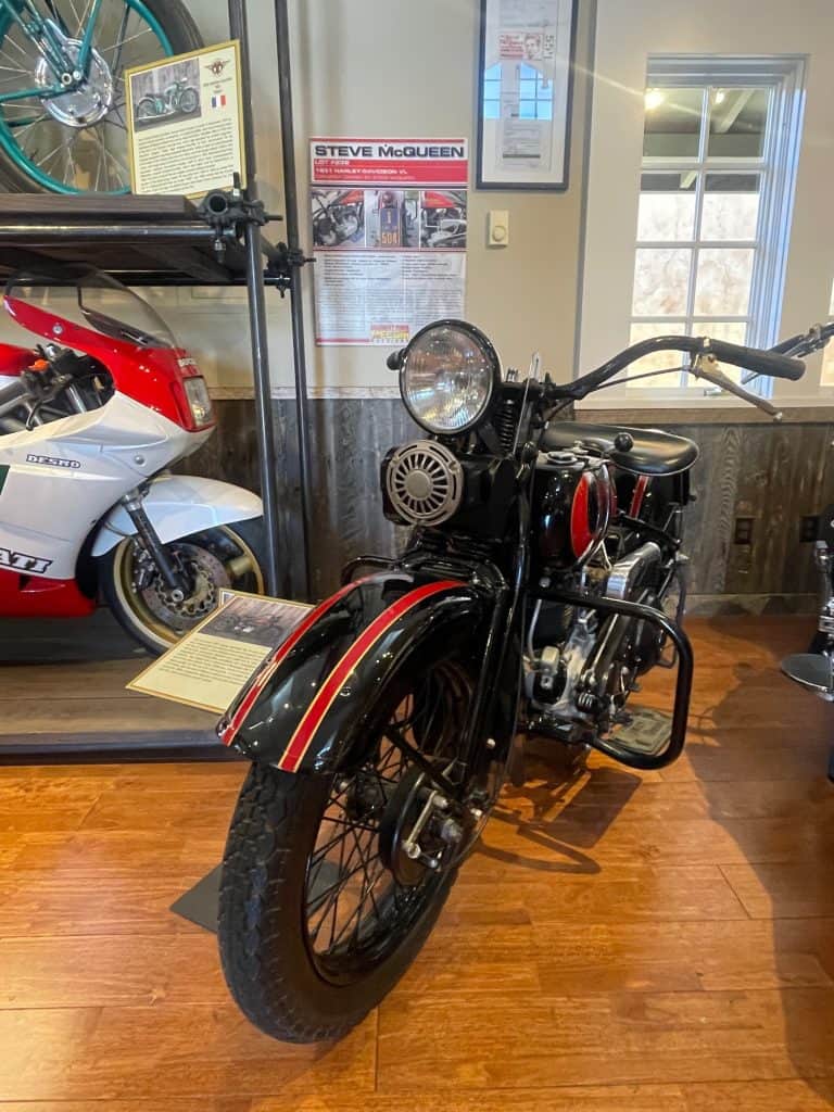 Steve McQueen's last bike, a black, pristine 1931 Harley Davidson, sits on the floor in the Moto Talbott museum in Carmel Valley, CA, photo ©Kate Dana