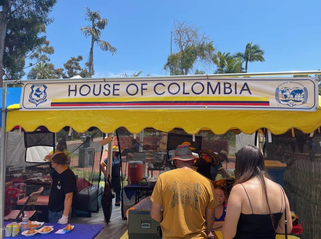 A crowd gathers for coffee outdoors at the House of Colombia in Balboa Park, San Diego, photo ©Kate Dana