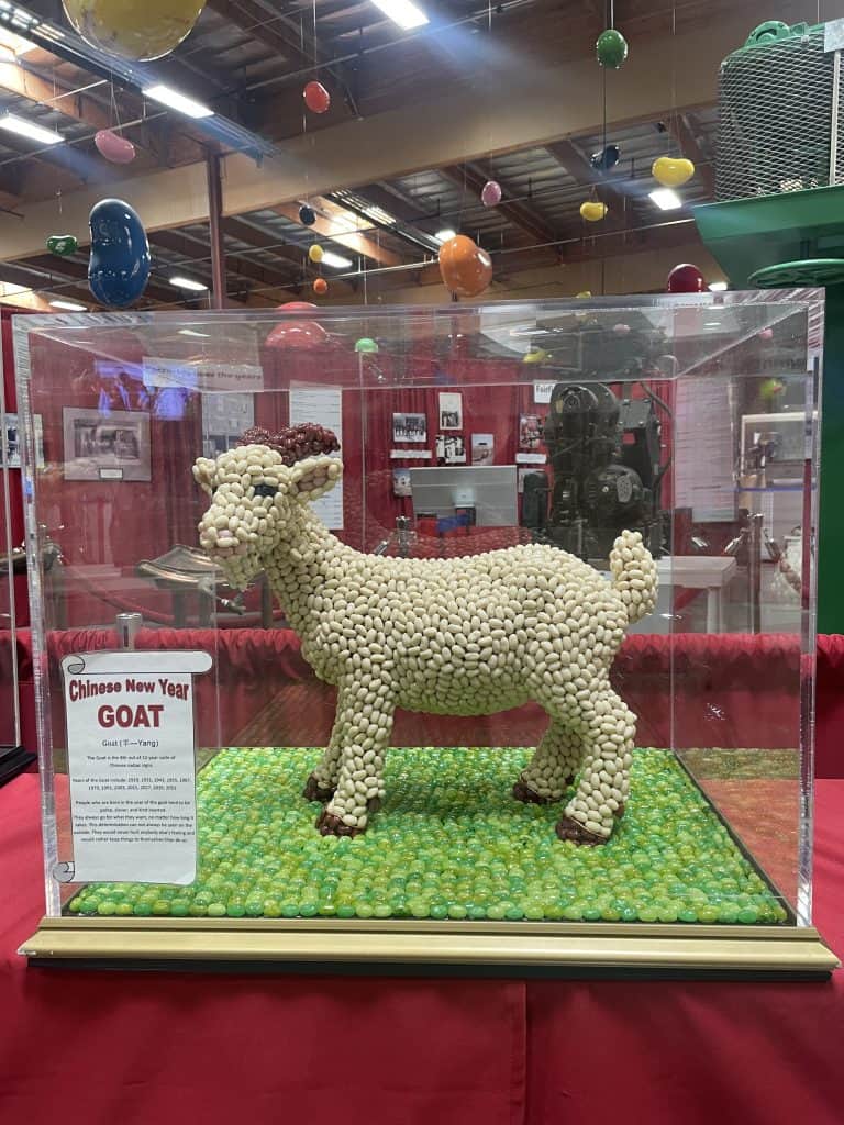 A tabletop-sized, colorful, mosaic statue of a goat made of jelly beans inside the Museum of the Jelly Belly Factory in Fairfield, CA, photo ©Kate Dana