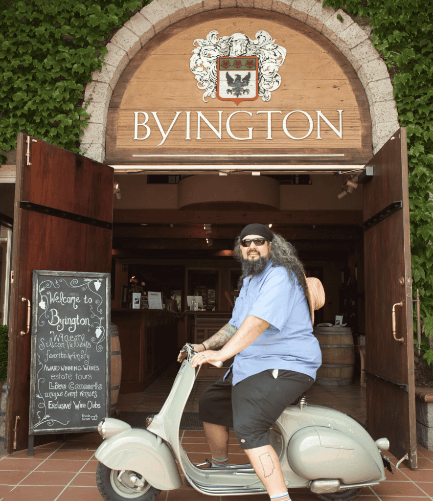 Vespa Club of America President 2021 Josh Rogers sits on a green, 1946 Vespa at the entrance to Byington Winery near Los Gatos, CA, photo ©Kate Dana