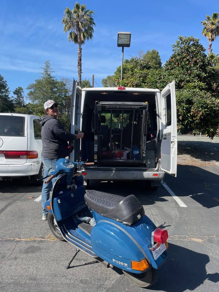 Joe Deason from Second Chance Scooters loads a bike into his mobile shop at Vintage Vespa Days 2022 in Los Gatos, CA, photo ©Kate Dana