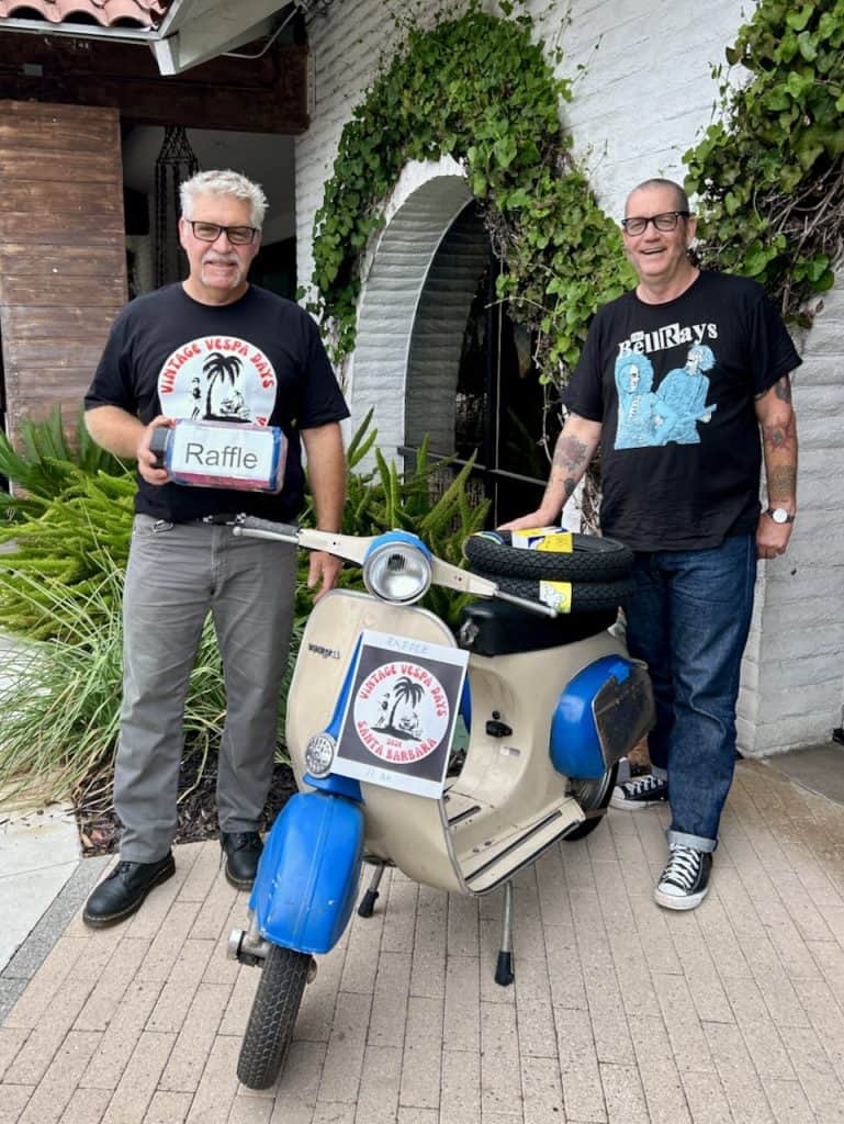 Scooterists stand outside The Leta hotel with the 2024 Vintage Vespa Days Santa Barbara raffle bike, photo ©Kate Dana