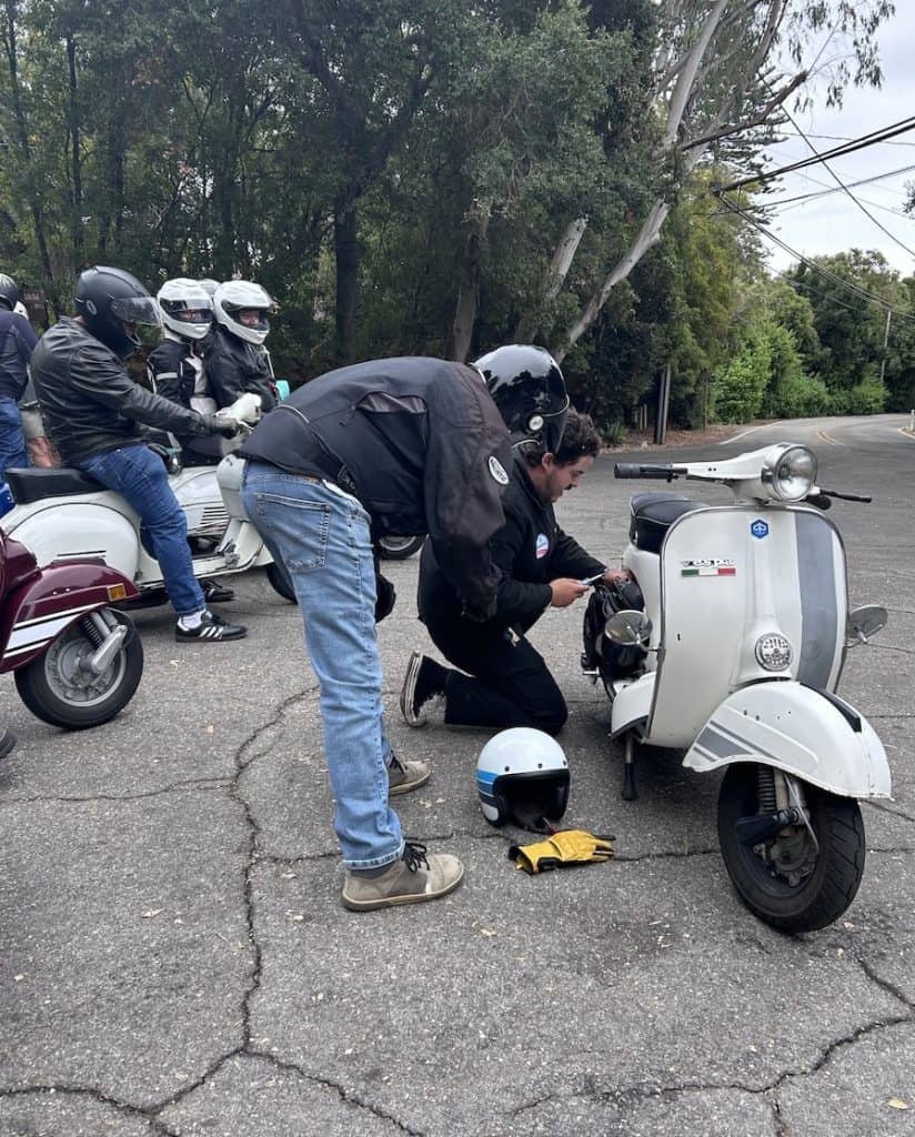 West Coast Vintage Vespa Days scooterists make a roadside repair in the Santa Barbara hills, photo ©Kate Dana