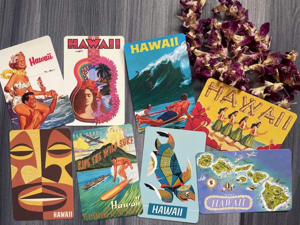 Colorful, vintage-like postcards from ABC Stores in Honolulu depict tiki, surfing, islands, and other graphics, photo ©Kate Dana