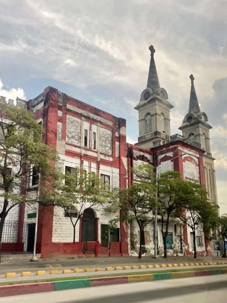 a colorful church on a busy street in Barranquilla, Colombia, photo ©Kate Dana