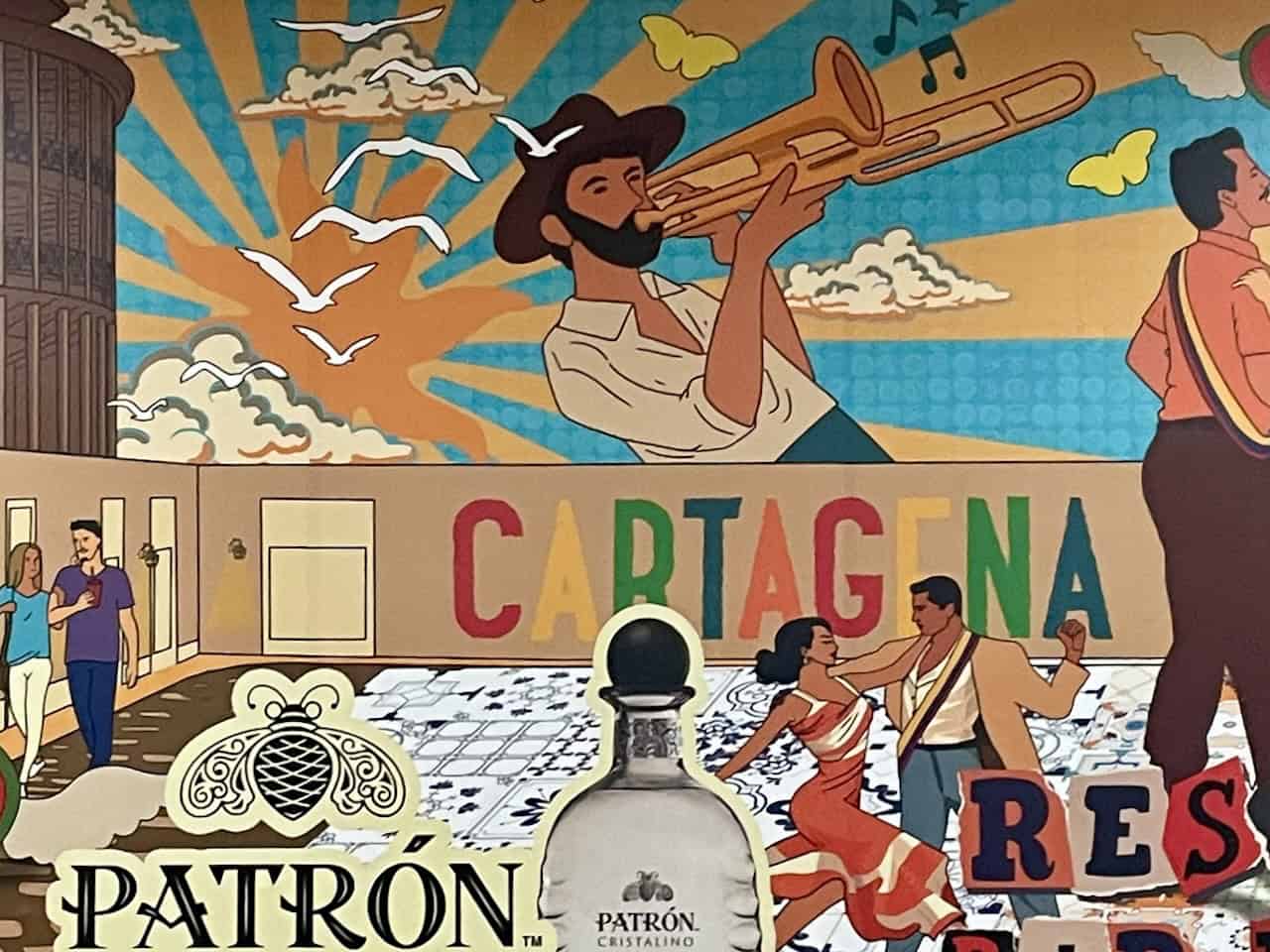 A colorful mural of Cartagena featuring people and musical artists