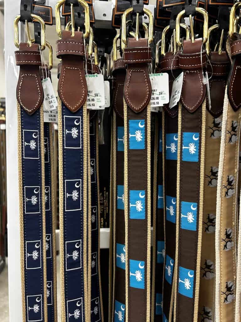 Belts featuring palmetto tree motifs hang on a store wall in Charleston, S.C. photo ©Kate Dana