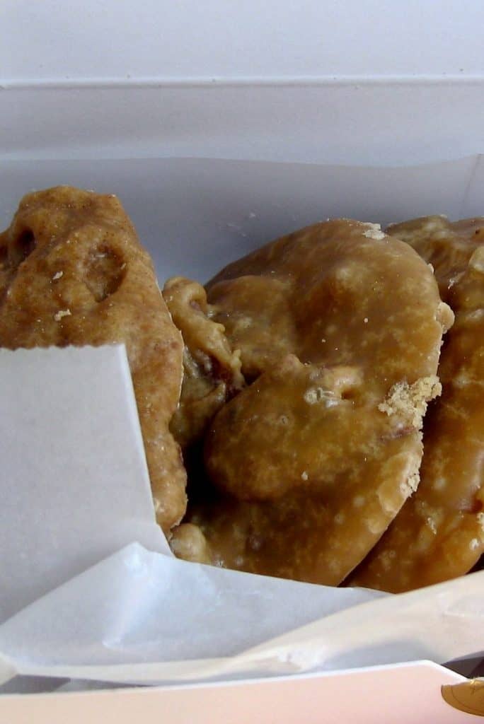 Warm, buttery pecan pralines in waxed paper, a Southern delight, photo ©Kate Dana