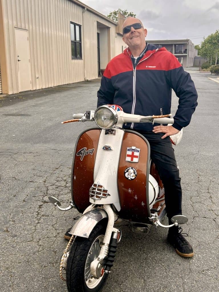 A scooterist on a vintage Lambretta near the Santa Cruz Cider Company in Watsonville, CA, photo ©Kate Dana