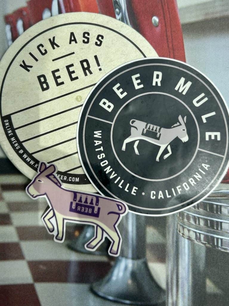 A small collection of stickers announce Beer Mule at The Hangar in Watsonville, CA, photo ©Kate Dana
