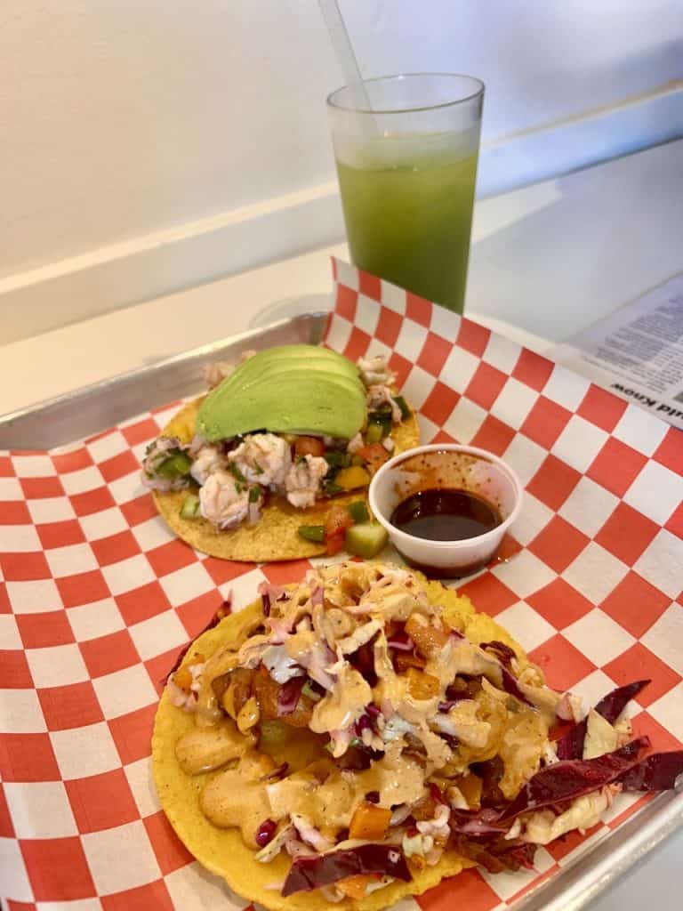A tray with a mango shrimp tostada and Baja fish taco from Tacos al Fuego at The Hangar in Watsonville, CA photo ©Kate Dana