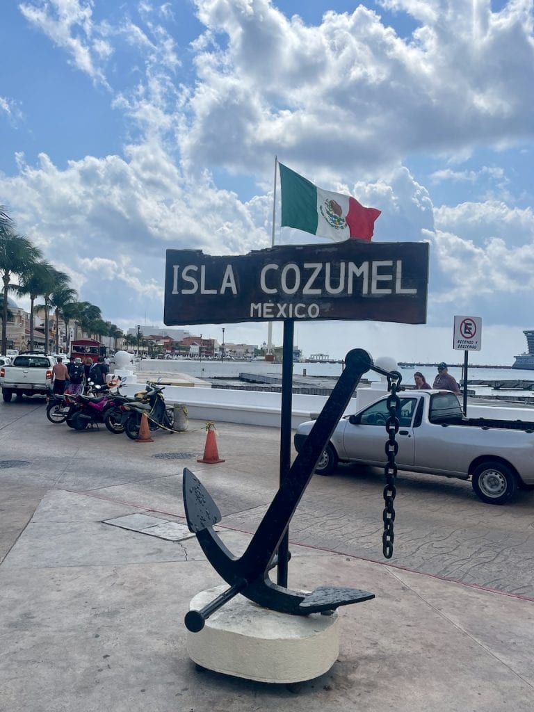 A large anchor next to a sign announcing you've arrived in Isla Cozumel, Mexico, photo ©Kate Dana