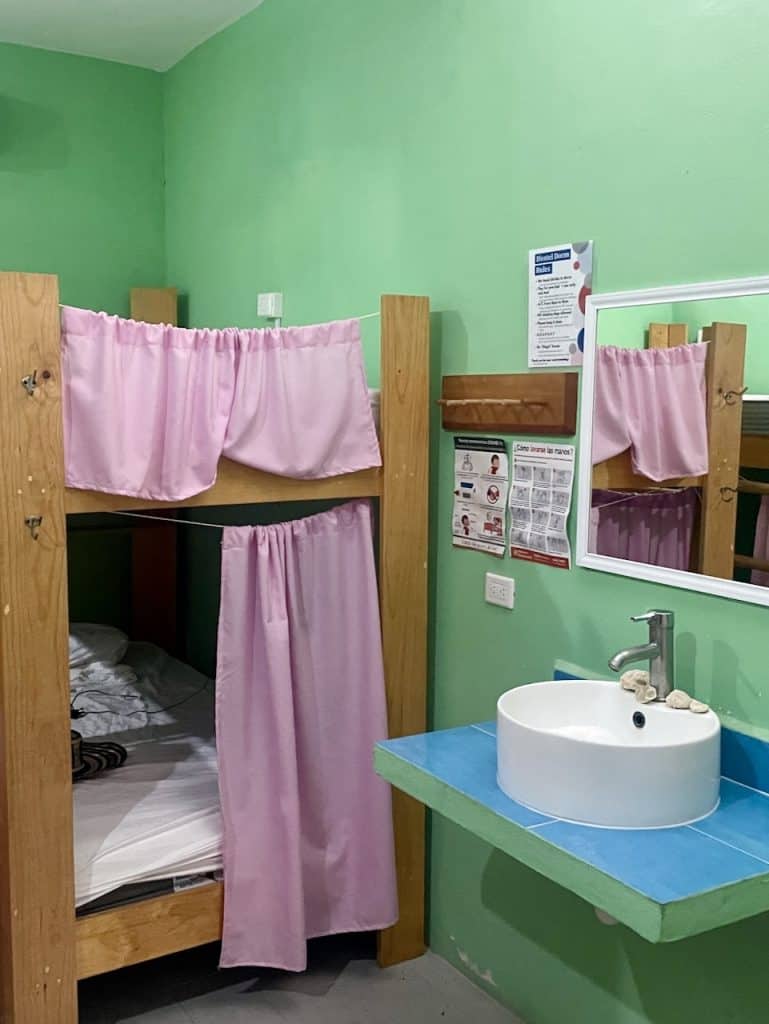 A colorful dormitory room with a sink at Blue Magic Hostel in Isla Cozumel, Mexico, photo ©Kate Dana