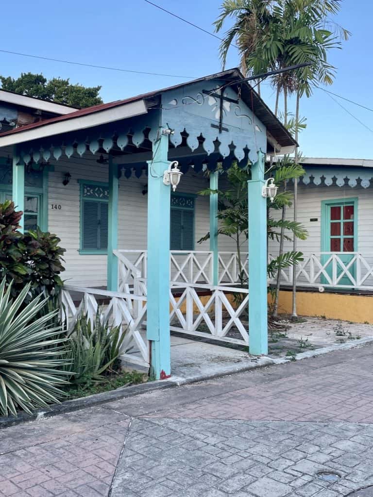 A colorful small home with lush plants on a street in Isla Cozumel, Mexico, photo ©Kate Dana