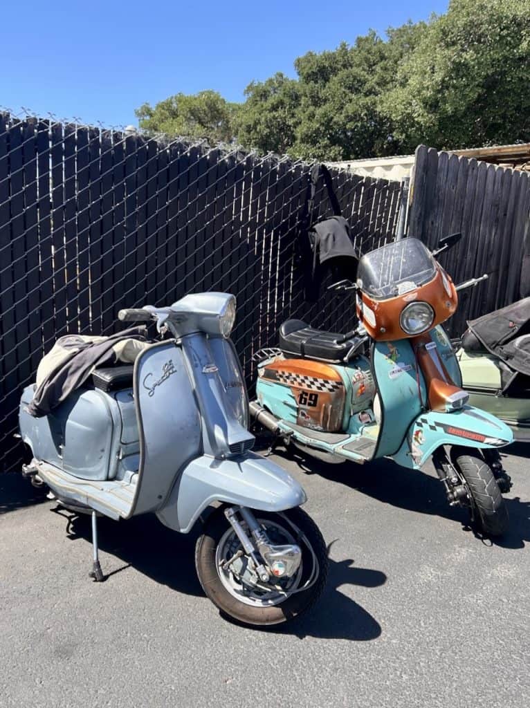 Several vintage Lambretta scooters parked together in Santa Rosa, California, photo ©Kate Dana