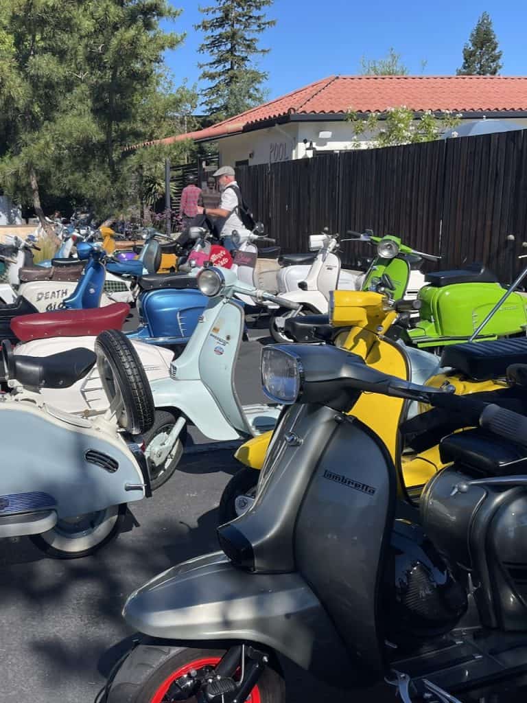 Several vintage Lambretta scooters parked together in Santa Rosa, California, photo ©Kate Dana